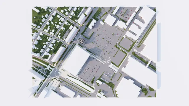 Pohled shora na urbanistický model území s obchodním centrem, parkovišti, komunikacemi a navazující zástavbou rodinných domů
