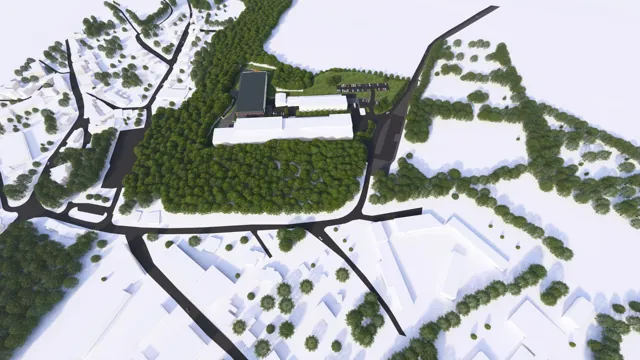Architektonická vizualizace průmyslového areálu — šikmý letecký pohled na haly, příjezdovou komunikaci a parkoviště