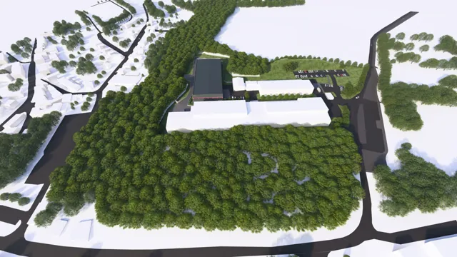 Architektonická vizualizace hal a průmyslového areálu — letecký pohled na budovy, příjezdové komunikace a parkovací plochy