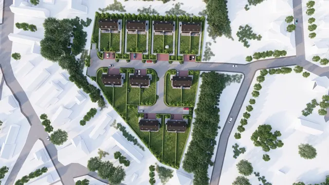 Detailní pohled shora na obytný soubor dvojdomů s parkovacími stáními, zahradami a vnitřní komunikací